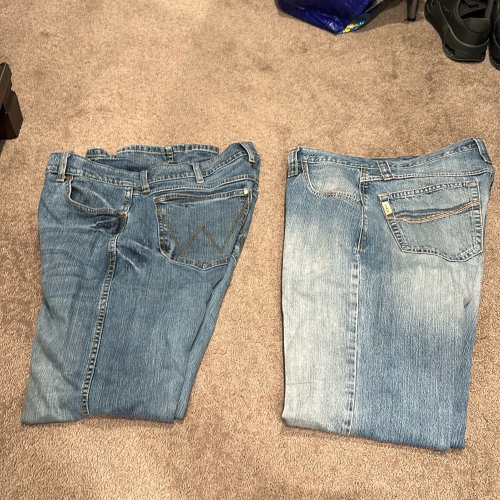 Two pair of damaged jeans 34x34 Cinch Lucas and Wrangler Slim boot